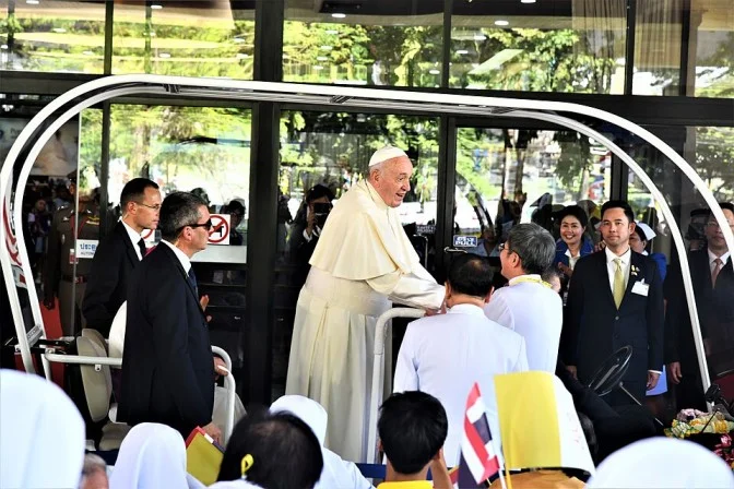 Pope Francis meeting crowds and clergy during an official hospital visit