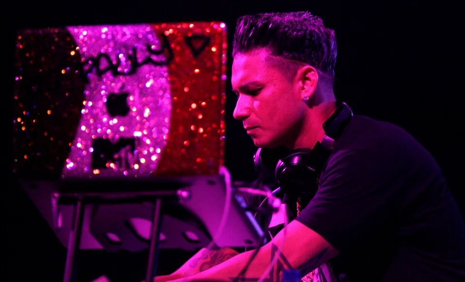 Pauly D mixing live on his custom glitter DJ setup