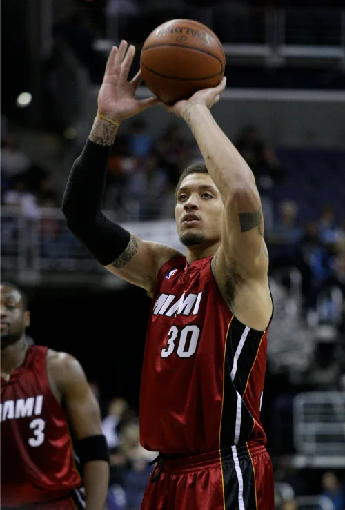 Michael Beasley shooting free throw in Miami Heat number 30 jersey during NBA game