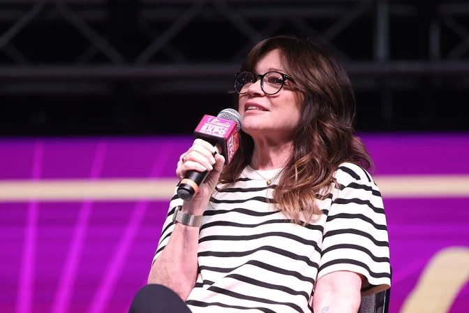 Valerie Bertinelli speaking with a microphone at a live event