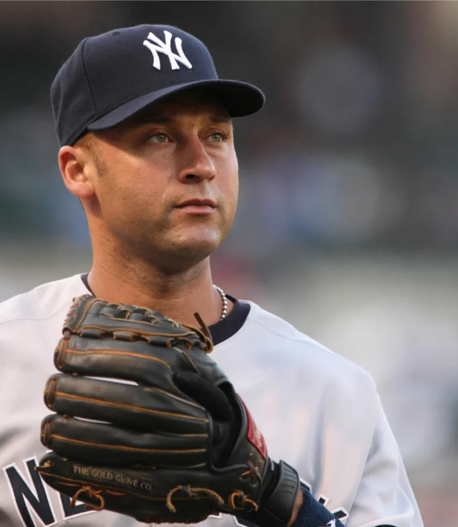Derek Jeter in white Yankees uniform with glove, five-time World Series champion