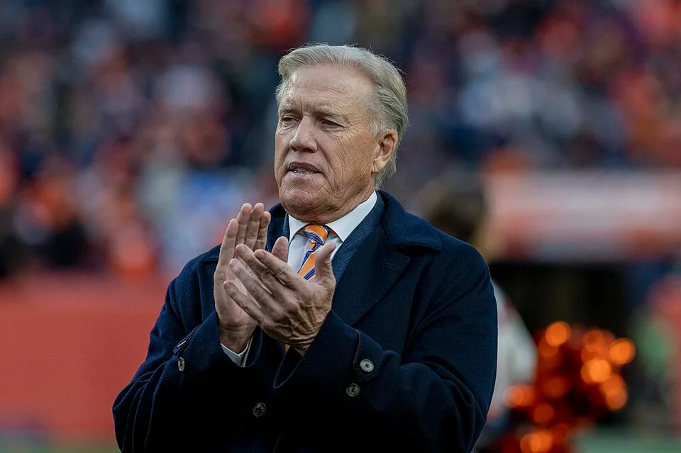 John Elway on the Broncos sideline during his final season as president of football operations — mantlemagazine.com