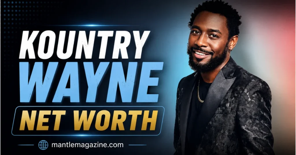 Kountry Wayne net worth 2026 – comedian Kountry Wayne smiling in a black patterned blazer