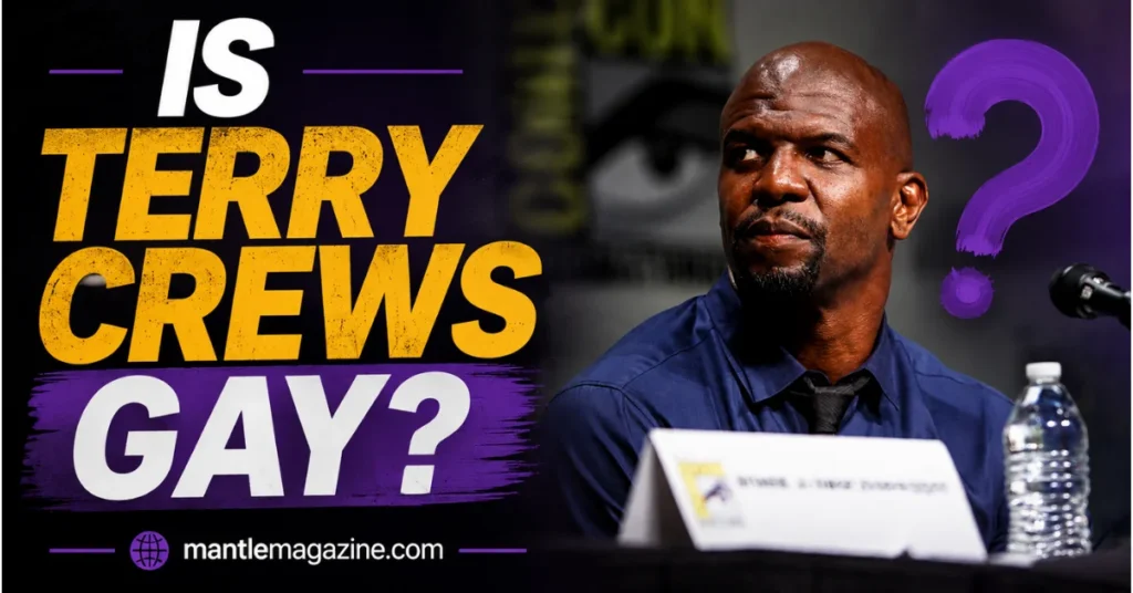 "Actor Terry Crews in blue shirt at press conference, wearing black tie, seated at table with water bottle and nameplate"