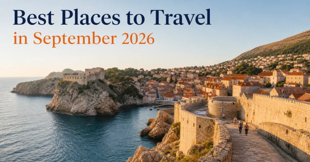 Best places to travel in September: a few walkers on Dubrovnik's old town walls above the Adriatic in warm light
