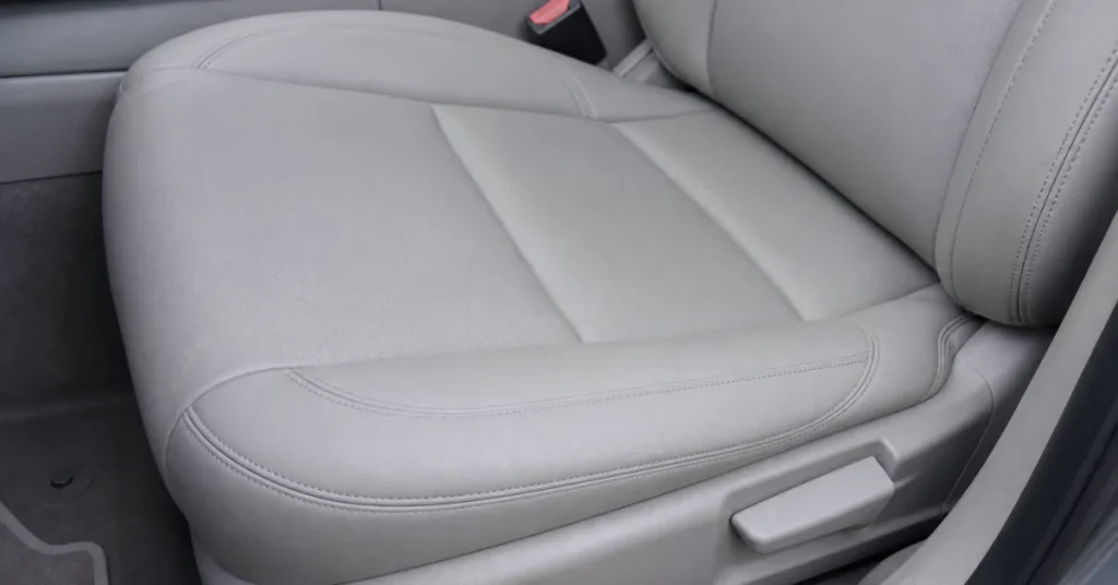 How to fix burn hole in car seat: a clean light-gray seat after repair with no visible damage