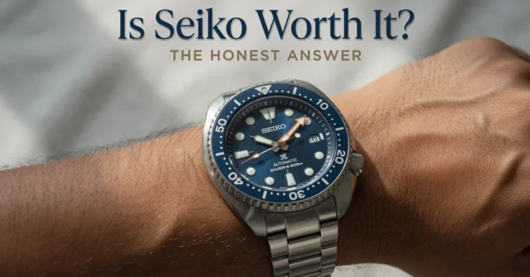 Seiko automatic diver's watch with blue dial and bezel on a wrist, macro close-up