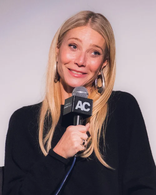 Gwyneth Paltrow at press event with microphone, Goop CEO discussing business challenges