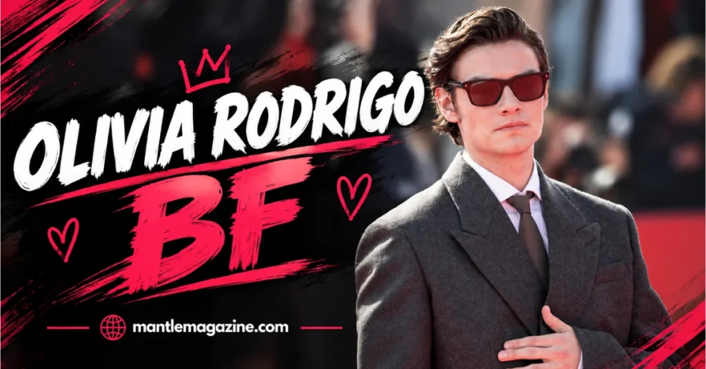 Louis Partridge in a gray suit and sunglasses — featured graphic about Olivia Rodrigo's boyfriend
