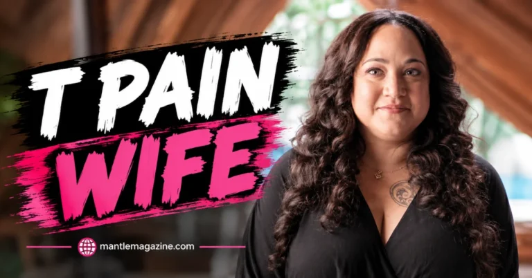 Amber Najm, wife of rapper T-Pain, smiling in a black top with long curly hair and a chest tattoo