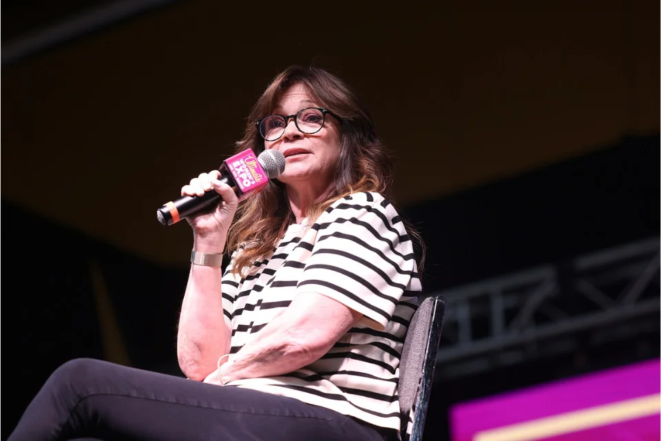 Valerie Bertinelli speaking into a microphone at a public event