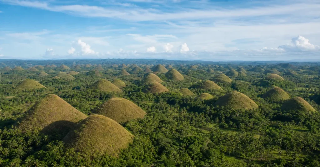 Best islands in the Philippines: aerial view of Bohol's Chocolate Hills showing hundreds of conical mounds across the landscape