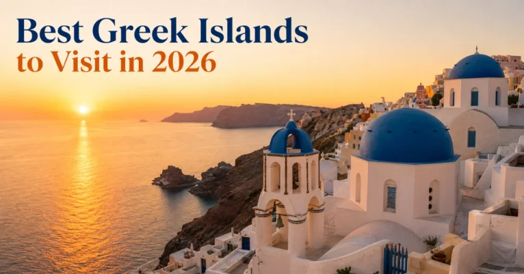 Best islands to visit in Greece: whitewashed Oia village with blue domes overlooking the Santorini caldera at sunset