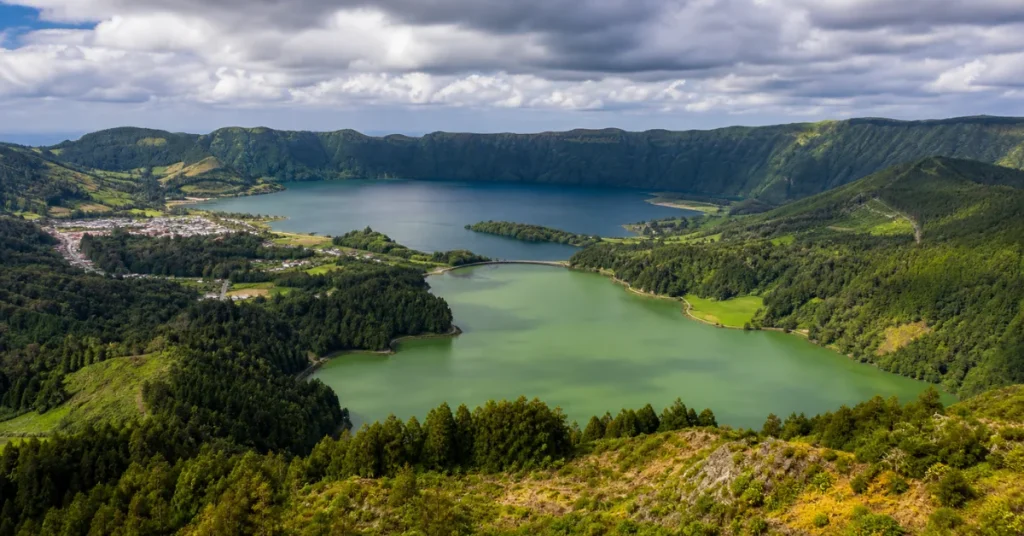 Best places to visit in Portugal: the twin blue and green crater lakes of Sete Cidades viewed from the volcanic rim on São Miguel island in the Azores