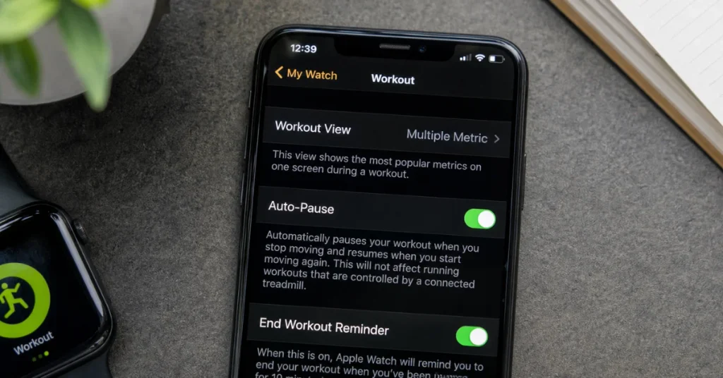 Cancel pause on Apple Watch: iPhone Watch app open to Workout settings showing the Auto-Pause toggle switched on beside an Apple Watch